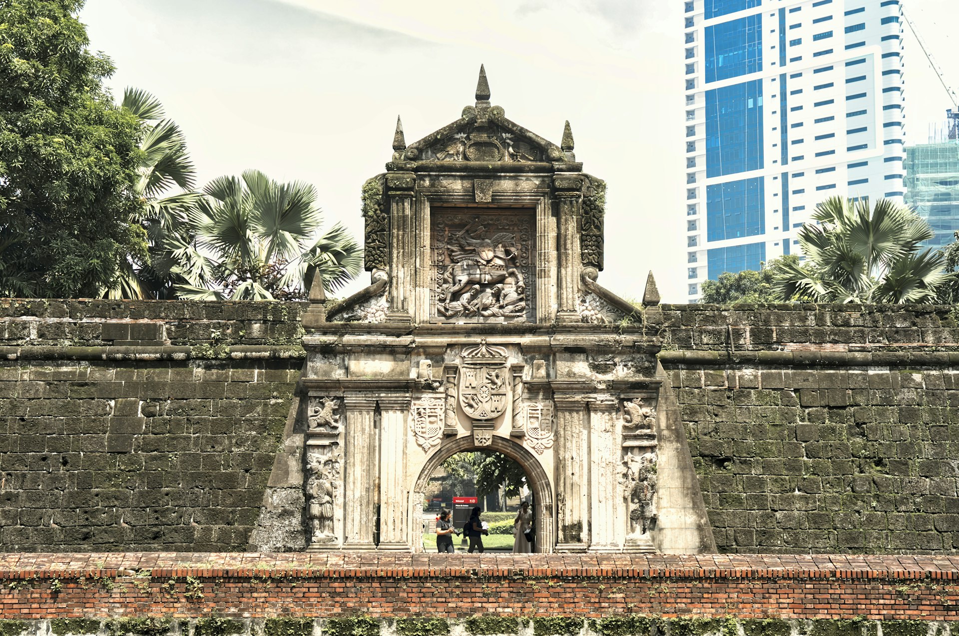 Stone gate and clock tower inside the walled city of Intramuros, Manila
